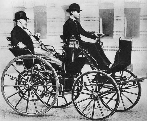 Gottlieb Daimler, with his son driving, in the first motor car, 1886 (bw photo), German Photographer (20th Century)  Private Collection  © Look and Learn  Bridgeman Images 5998019