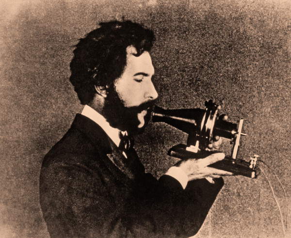 Portrait of Alexander Graham Bell speaking into a telephone receiver, c.1876 (photo)  Private Collection  Prismatic Pictures  Bridgeman Images  6425714