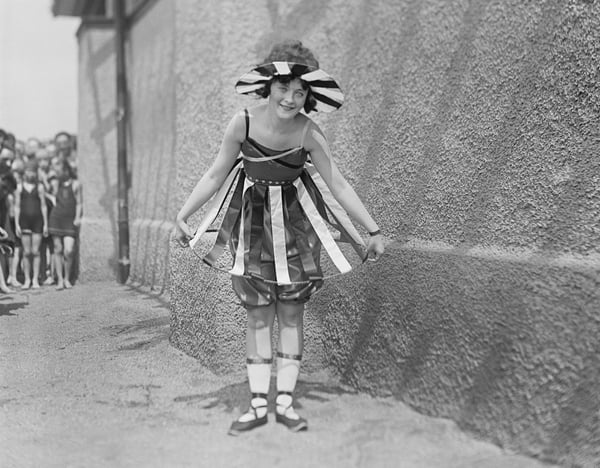 black and white vintage photo of Young Girl at Bathing Beach Parade, Portrait, Washington DC, USA, 1919 (b/w photo) © Circa Images / Bridgeman Images