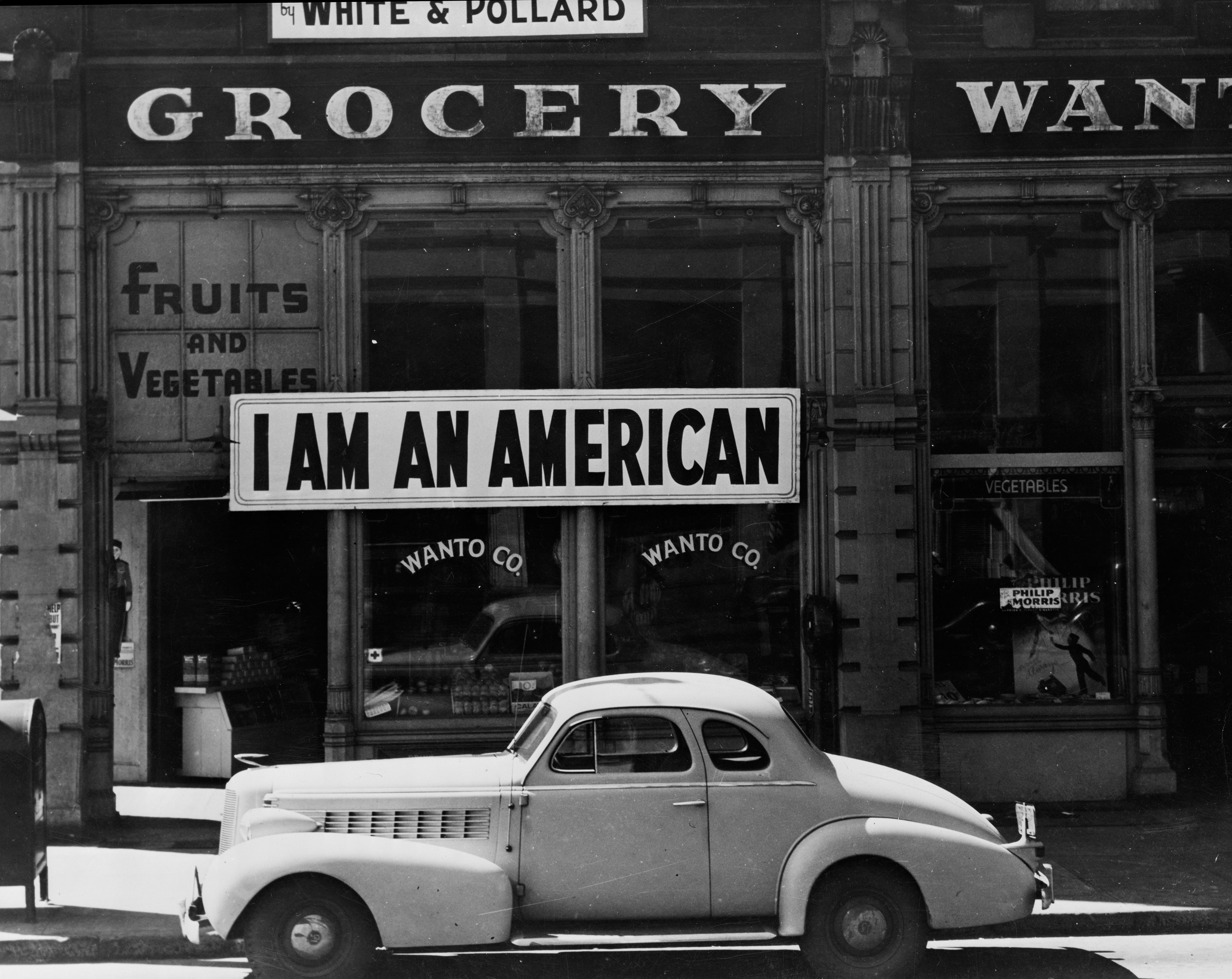 I am an American or Japanese American shop owner in Oakland, California hopes to avoid internment after the bombing of Pearl Harbor, 1942 (b/w photo), Dorothea Lange, (1895-1965) / Private Collection / Bridgeman Images