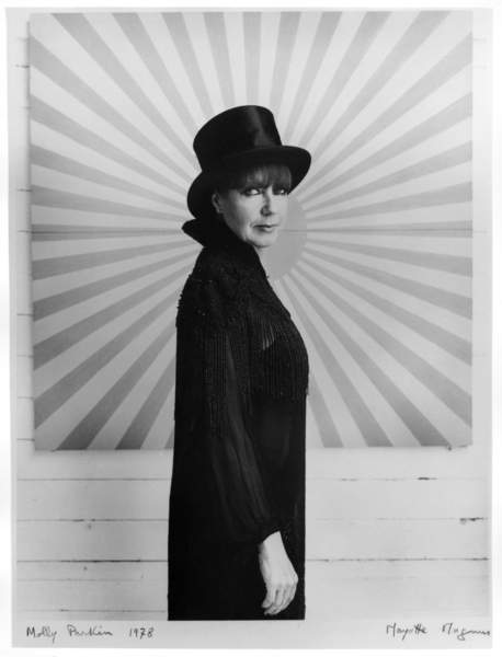 Molly Parkin against painting - hat and rays, 1977 (bw photo), Magnus, Mayotte (b.1934)  Private Collection  © Magnus-Lewinska Mayotte  Bridgeman Images 