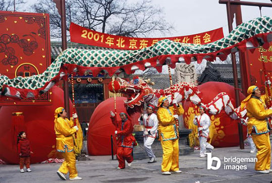 The Dragon Dance being performed at the New Year Temple Fair. Dongyuemiao. Beijing, China. / Sovfoto / UIG / Bridgeman Images