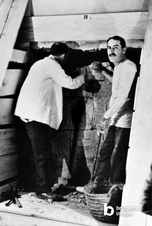 Image of HOWARD CARTER (1873-1939) English archaeologist. Carter (right) with Lord Carnarvon at the entrance to the inner chamber of Tutankhamen's tomb in the Valley of the Kings, Egypt, 1923, © Granger / Bridgeman Images