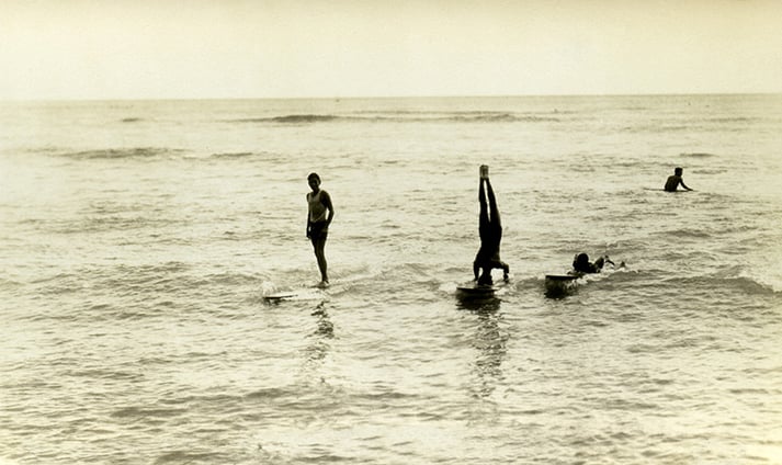 Surfers at Waikiki Beach (b/w photo), Hawaiian Photographer, (20th Century) / Mark and Carolyn Blackburn Collection of Polynesian Art