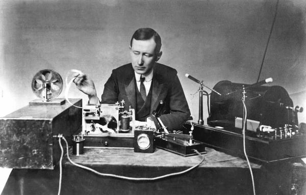 Guglielmo Marconi (1874-1937), Italian physicist and inventor. Radio pioneer. Marconi with typical apparatus, including 10-inch induction coil spark transmitter (right), morse inker and 'grasshopper' key in centre. Photograph. / Universal History Archive/UIG