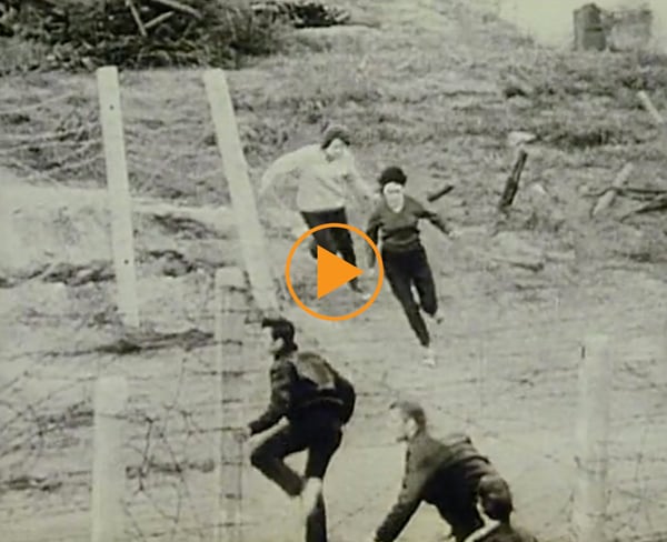 Building of the Berlin Wall, 1961. Civilians attempt to cross it / Buff Film & Video Library