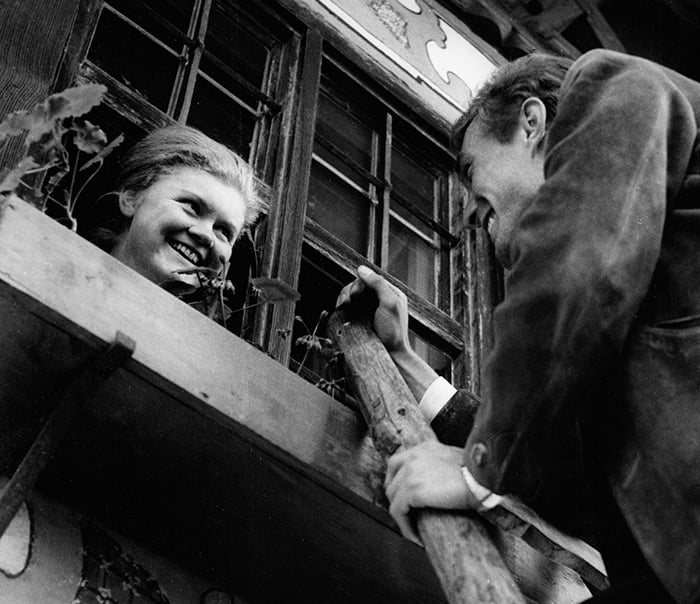 A man climbing a ladder to visit a girl in Bavaria, 1968, German Photographer / © SZ Photo / Kurt Schraudenbach / Bridgeman Images