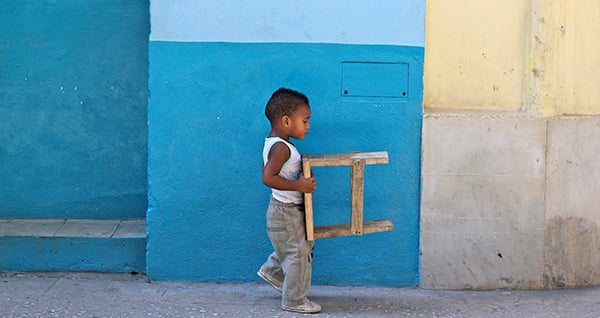 HWB614031 Boy carrying stool, Havana, Cuba (photo) by .; (add.info.: Boy carrying stool, Havana, Cuba); Photo © Holly Georgia Webster; out of copyright
