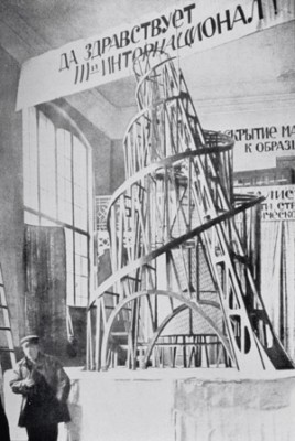 Model of the Monument to the Third International, at an exhibition in Moscow in 1920, with Tatlin in foreground (photo)
