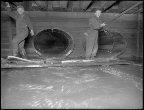 Men working in the W. 129th Street sewer