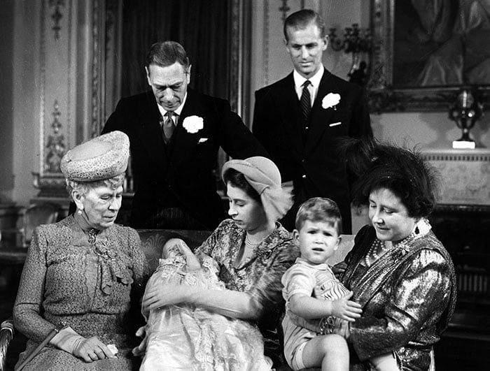 British Royal Family: Princess Elizabeth (future Queen Elizabeth II) with her daughter Princess Anne, Prince Charles on Queen Mom's knees. Beside her, Queen Mum Elizabeth (born Bowes-Lyon), Prince Philip, Duke of Edinburgh, King Georges VI, 1950)