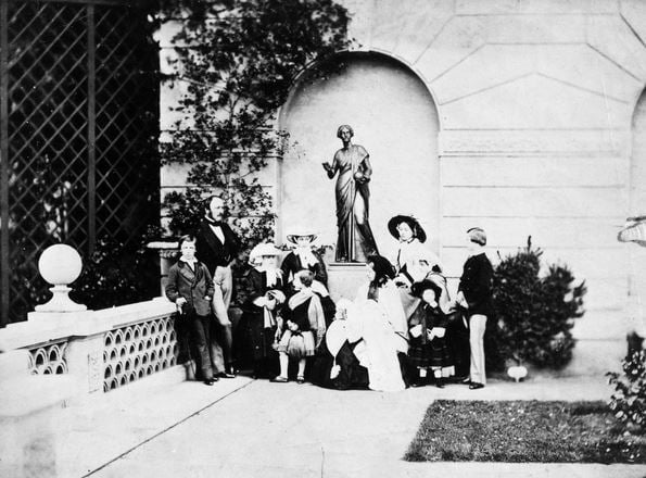 VICTORIA & FAMILY, 1857 The Royal Family on the terrace of Osborne House, 1857. From left to right: Prince Alfred, Prince Albert, Princess Helena, Prince Arthur, Princess Alice, Queen Victoria with the Princess Beatrice in her lap, Princess Victoria, Princess Louise, Prince Leopold & Prince Edward. / Photo © Granger 