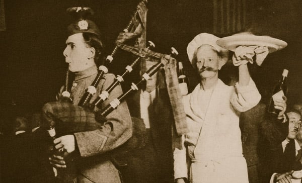 Scottish piper introduces the haggis to a Caledonian Banquet, London (sepia photo)