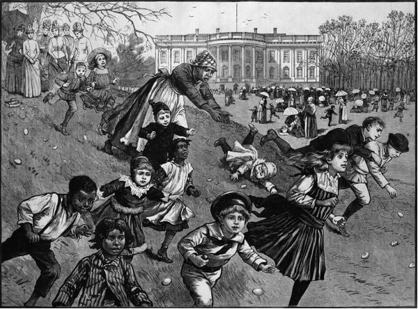  EASTER, 1887 Children chasing eggs at the annual Easter Egg Roll at the White House lawn in Washington, D.C. Wood engraving, American, 1887. / Photo © Granger
