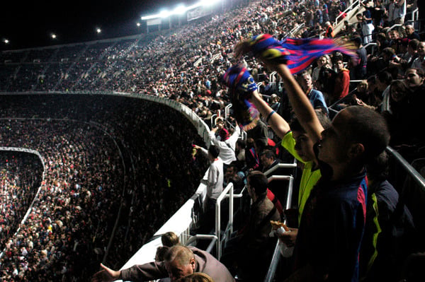The crowd at a football game in Barcelona, Spain / PYMCA/UIG / Bridgeman Images