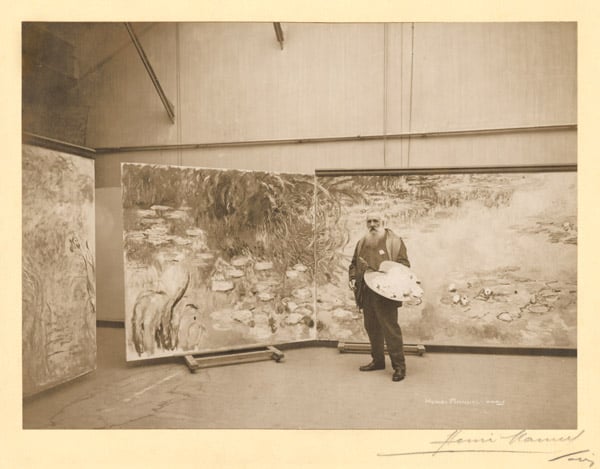 Claude Monet (1840-1926) in front of his paintings 'The Waterlilies', in his studio at Giverny, 1920 by Henri Manuel (1874-1947) / Musee Marmottan Monet, Paris / Bridgeman Images