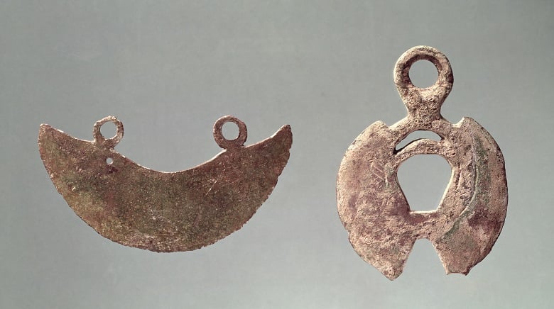 Two razors, from Hallstatt cemetery (bronze), Iron Age / Musee des Antiquites Nationales, France / Giraudon