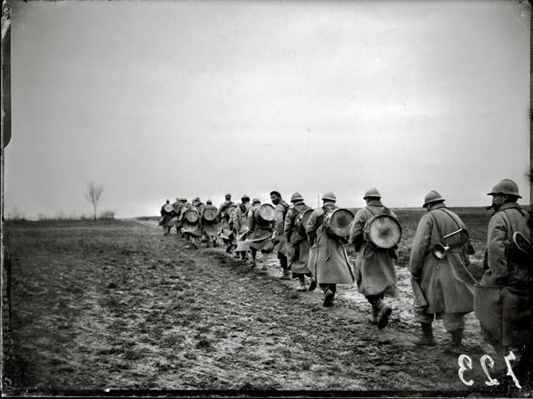 Soldiers on their way back from an attack, 1915 (b/w photo)