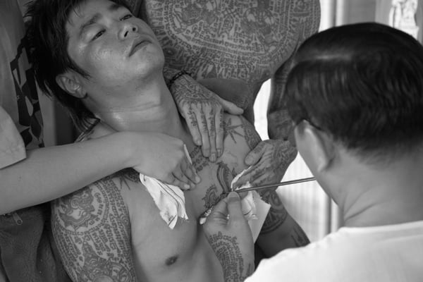 Traditional Thai tattoos (b/w photo) / Thailand / Photo © Luca Tettoni / Bridgeman Images