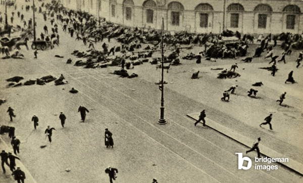 Bolshevik protest scattered by machine guns. Nevsky Prospect, Petrograd. July 4,1917. Street demonstrators were fired on by troops of the Provisional Government from the roof of the Public Library. The Bolsheviks unsuccessfully try to direct these protests into a coup, and Lenin was forced into hiding. However, 'The July Days' confirmed the popularity of the anti-war, radical Bolsheviks / Everett Collection / Bridgeman Images