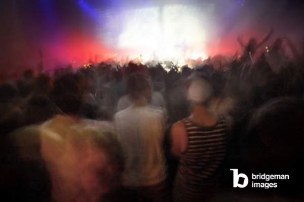 Wide shot of a crowd of revellers during a night gig at the Sonar festival, Barcelona / PYMCA/UIG / Bridgeman Images