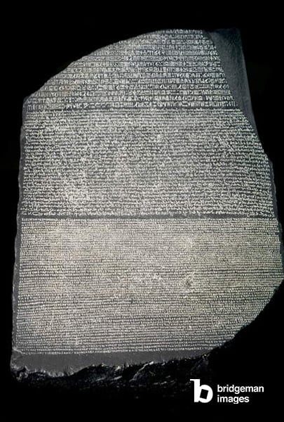  Rosetta stone. It is a priestly decret affirming the worship of King Ptolemee V Epiphane (210 BC - 181 BC). The decret is inscribed three times in hieroglyphs, demotic and Greek. The stone was discovered by the army of Napoleon in 1799 in the Rosette region of Egypt /Luisa Ricciarini / Bridgeman Images