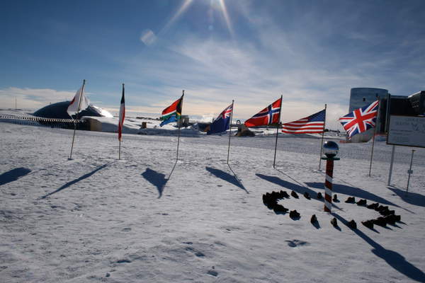 Flags representing Japan, France, South Africa, Australia, Denmark, United States and United Kingdom placed on ice sheets surrounding Xavier Cortada's installation at the South Pole. The installation aims to highlight climate change. The installation will last for 150,000 years and will map the change to the ice sheets as a result of temperature changes.
