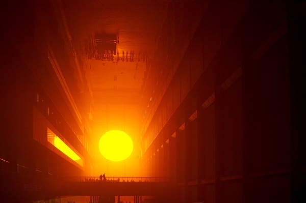 The Weather Project - the artificial sun in the turbine hall of the Tate Modern art gallery in London, part of the exhibition by Olafur Eliasson, October 2003. OE: Icelandic artist, b. 1967.